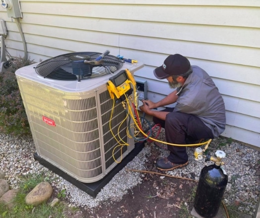 Bryan Air Conditioning Unit Being Serviced