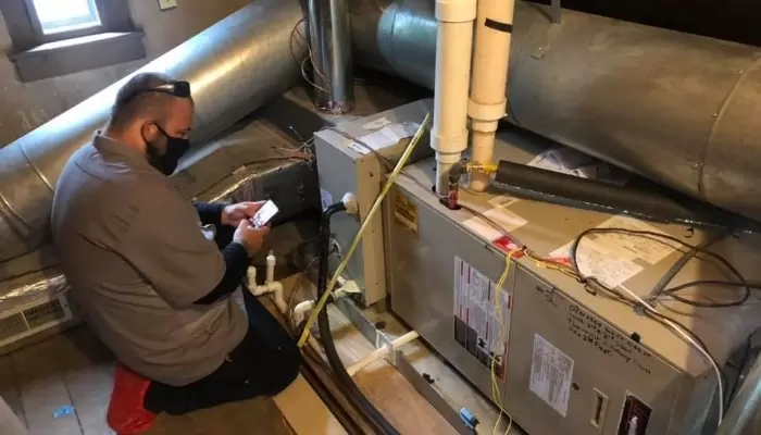 Masked Technician Air Handler